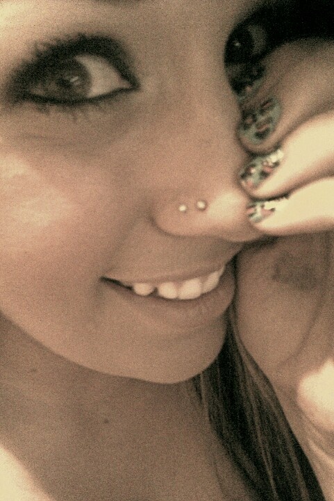 Double stud nose store piercing same side