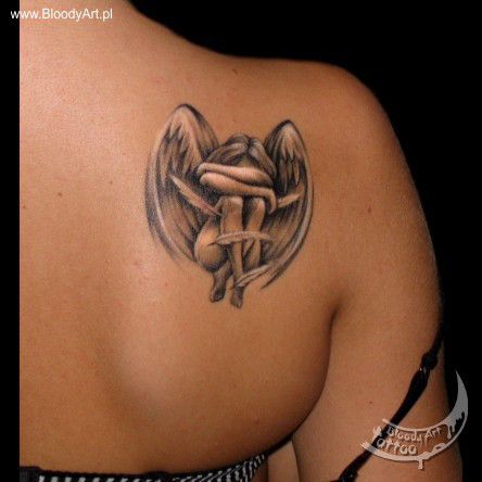 Black angel tattoo